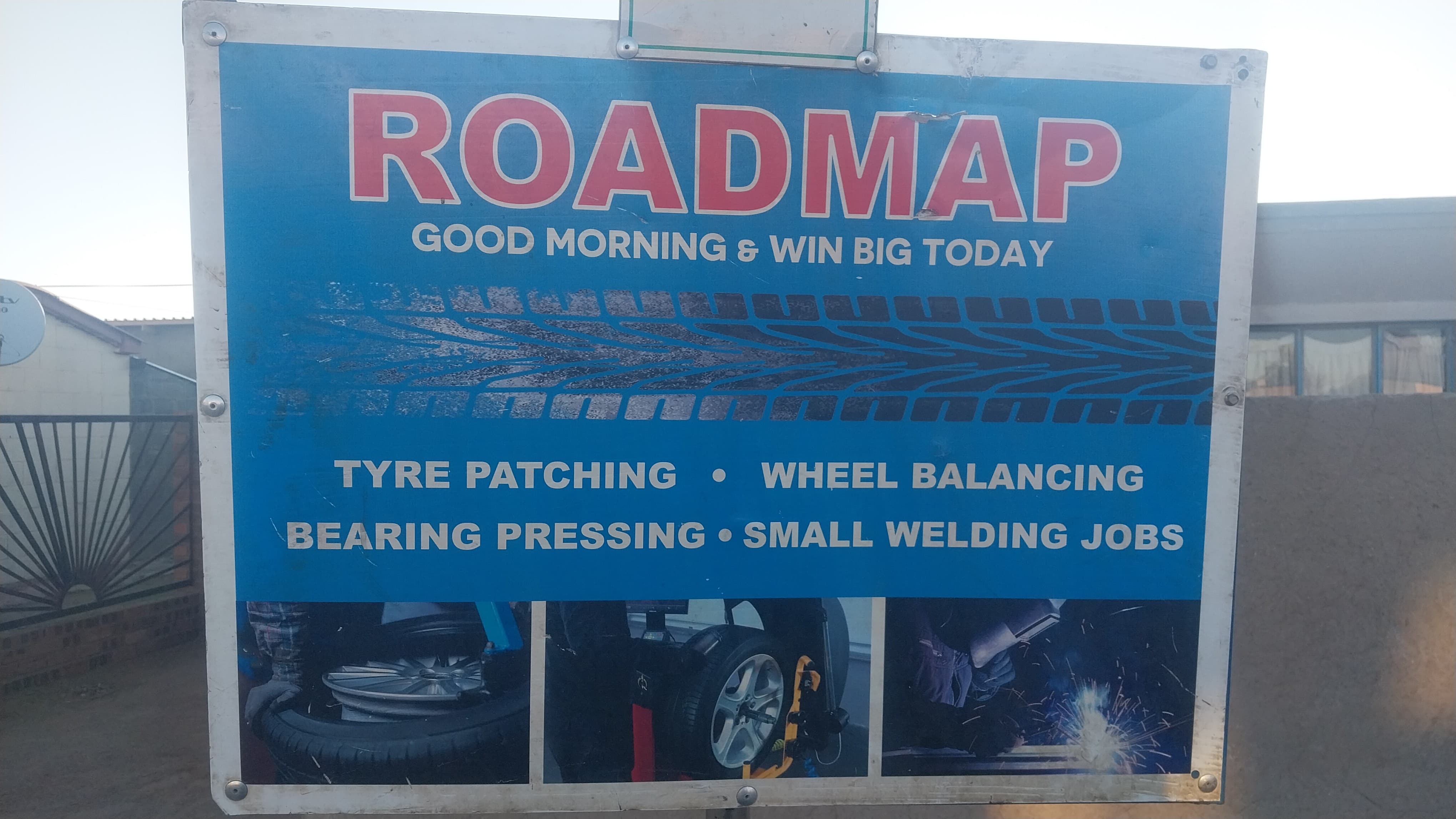 A mechanic working on a vehicle in a workshop.